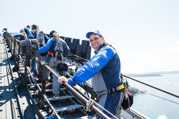 Artistic director Wesley Enoch climbs the Sydney Harbour Bridge as part of a Sydney Festival event called Burrawa.