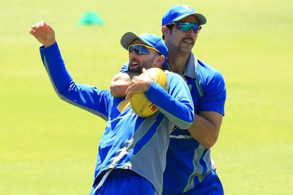 Mitchell Johnson wrestles with Nathan Lyon during training ahead of the 2015 Perth Test.