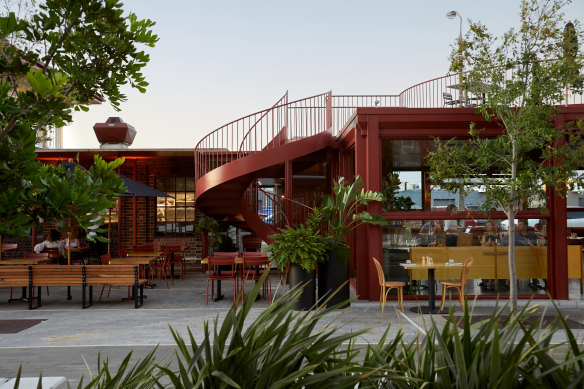 The blood-red oxide pavilion and awning, with its expressed streel beams, gives a subtle nod to the past.