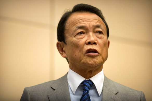 Japan’s Finance Minister Taro Aso speaks in Beijing.