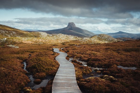 An Overland boardwalk with Barn Bluff in the distance.