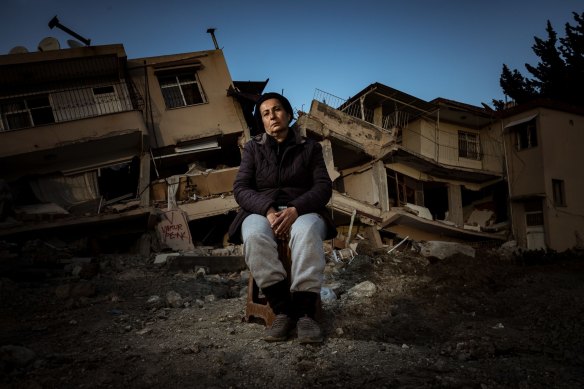 Betul Gomosh sits in front of the remains of her home in Antakya, Hatay Province, Turkey. A 7.8 magnitude earthquake followed by a 7.6 quake struck north-west Syria and southern Turkey on February 6 causing widespread destruction. 