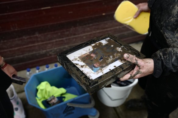 Maribyrnong residents continue with the flood clean-up on Sunday.