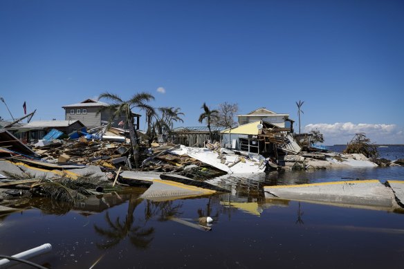 Damaged homes following Hurricane Ian in Matlacha Isles, Florida. Research firm Enki Holdings LLC pegs the economic cost of Hurricane Ian at $US60 to $US70 billion.