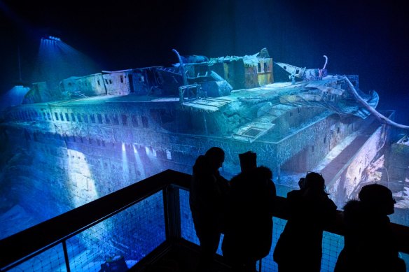 People look at a large-scale 360 degree panorama presentation of the Titanic shipwreck by artist Yadegar Asisi.