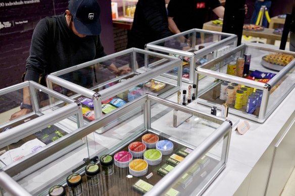 A customer checks out products for sale at a travel agency in Union Square, New York.