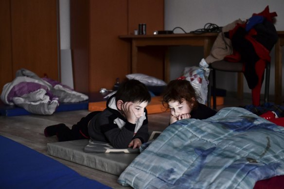 Children play at a temporary refugee shelter in Zahony, Hungary.