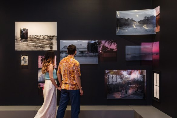 Visitors viewing the work by Tammy Law in “New Light: Photography Now + Then”, at Museum of Brisbane.