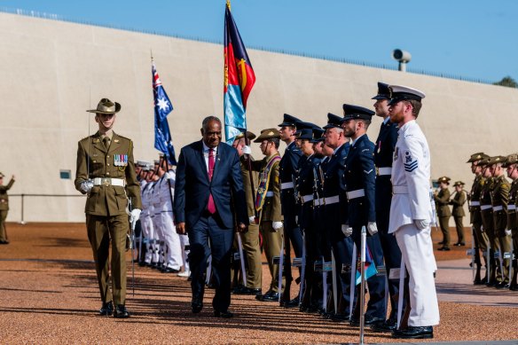 Vanuatu Prime Minister Ishmael Kalsakau receives a ceremonial welcome at Parliament House.