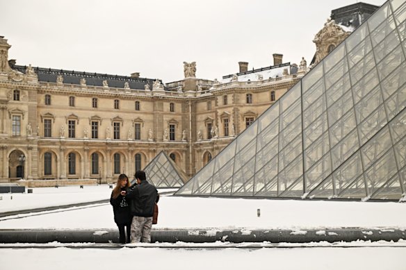 Embrace the cold and avoid the crowds – outside the Louvre in Paris in winter.