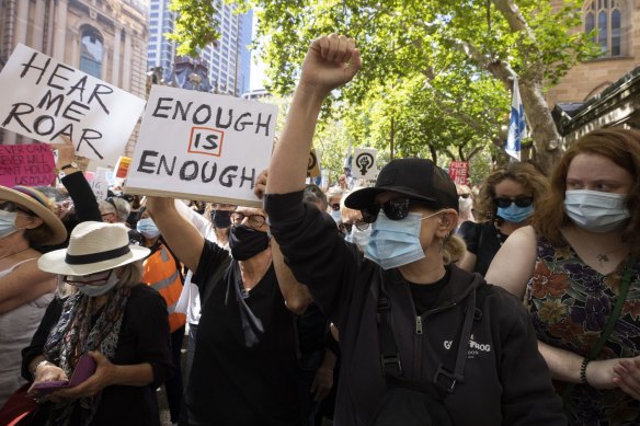 Many of the demonstrators are wearing masks. 