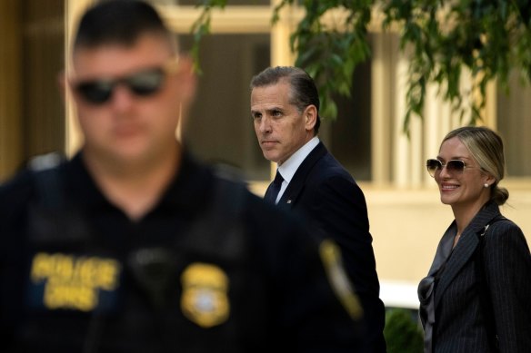 Hunter Biden, son of US President Joe Biden, and his wife, Melissa Cohen Biden,  exit the court in Wilmington. He is facing three federal gun charges.