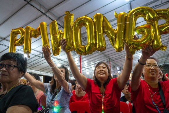 Supporters celebrate during a broadcast of the swearing-in ceremony.