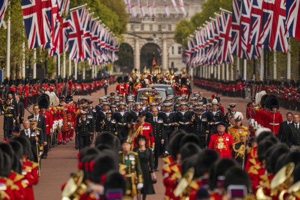 The coffin of Queen Elizabeth II is carried following her funeral service in Westminster Abbey.