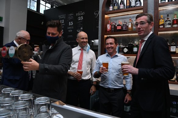 NSW Premier Dominic Perrottet (right) with NSW Deputy Premier Paul Toole (2nd from right) and NSW Treasurer Matt Kean (3rd from right) at Watson’s Pub in Moore Park on Monday.