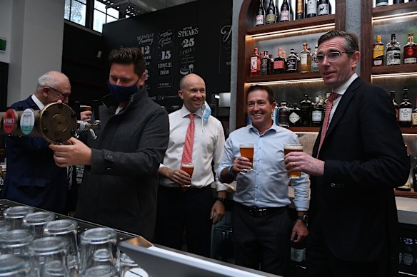 Sydney-siders are calling it ‘Freedom Day’ after restrictions were lifted at midnight last night. NSW Premier Dominic Perrottet (right) with NSW Deputy Premier Paul Toole and NSW Treasurer Matt Kean at Watson’s Pub in Moore Park today. 