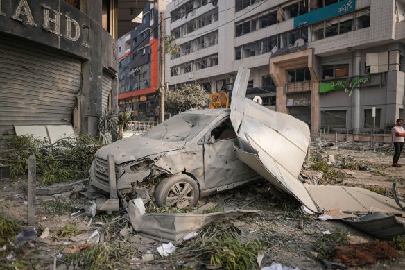 A destroyed car following an Israeli airstrike in Gaza City on Sunday.