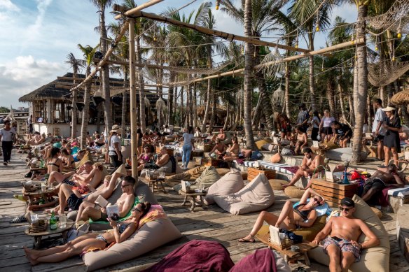 Tourists soaking up the sun in Canggu, Bali, shortly before the pandemic. Visitor numbers to Indonesia have since rebounded.