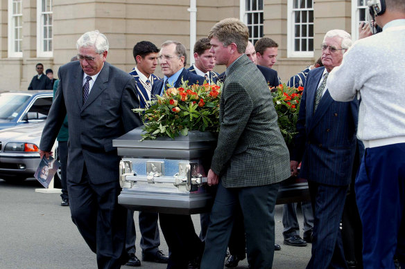 Hansie Cronje's father Ewie, left, and Cronje's only brother, Frans, right, carry his coffin.