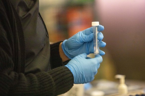 A test swab at a COVID-19 variant testing site inside the airport in Los Angeles.