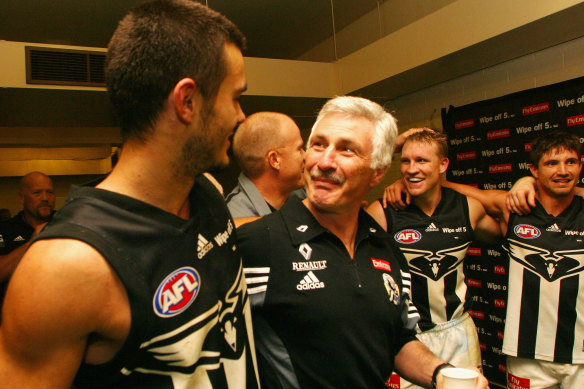 Collingwood coach Nick Malthouse congratulates Chris Tarrant after his match winning goal.