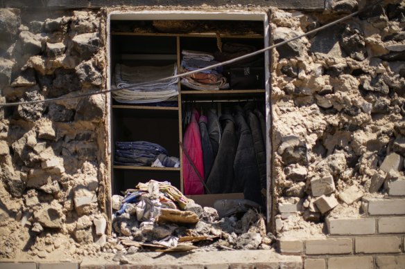Clothes hung in a closet of a destroyed house after a Russian rocket, hit by Ukraine’s anti-aircraft system, stroke in a residencial area in Zaporizhzhia, Ukraine, Thursday, April 28, 2022. 