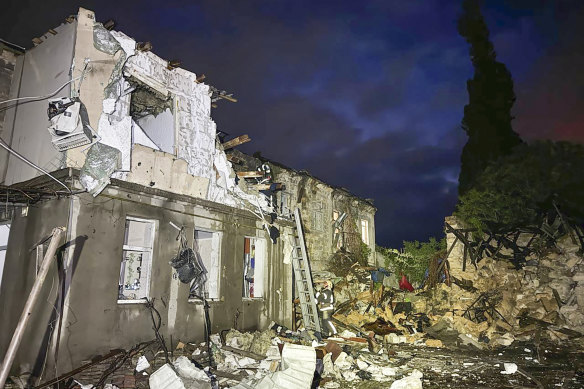 Firefighters work on the site of a damaged building after a Russian drone attack in Odesa, Ukraine.