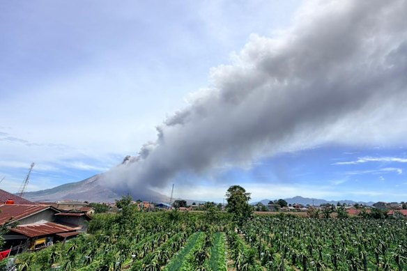 In this photo from the Geological Agency of Indonesia’s Ministry of Energy and Mineral Resources, Mount Sinabung releases volcanic materials into the air during an eruption on Monday, August 31. 
