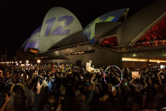 Protesters on the harbour foreshore against the promoting of the 2018 Everest horse race on the Opera House sails.