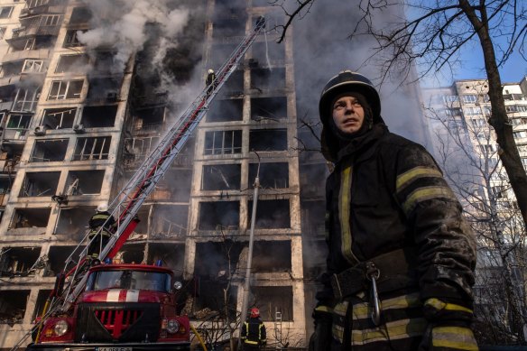 Firefighters work to extinguish a fire at a residential apartment building after it was hit by a Russian attack in the early hours of the morning in the Sviatoshynskyi District in Kyiv, Ukraine. Russian forces continue to attempt to encircle the Ukrainian capital, although they have faced stiff resistance and logistical challenges since launching a large-scale invasion of Ukraine last month.