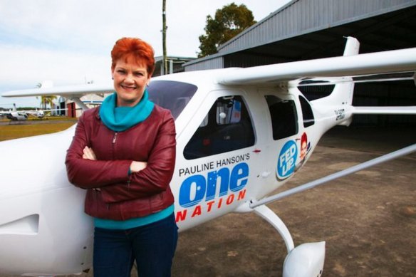 Pauline Hanson with the plane she used on her "Fed Up" campaign, which was allegedly bought with an undisclosed donation from Bill McNee.