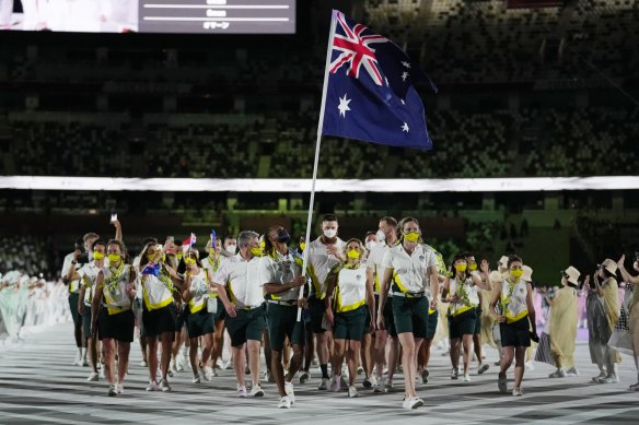Flag bearers Patty Mills and Cate Campbell lead the Australian team into the stadium during the opening ceremony. 