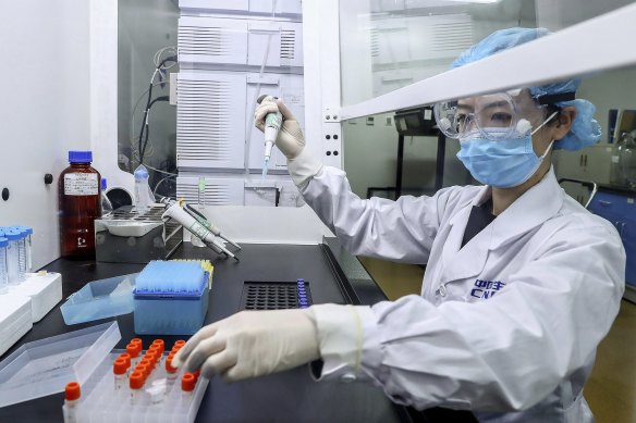 A technician tests samples of a potential COVID-19 vaccine at a production plant of SinoPharm in Beijing in April.