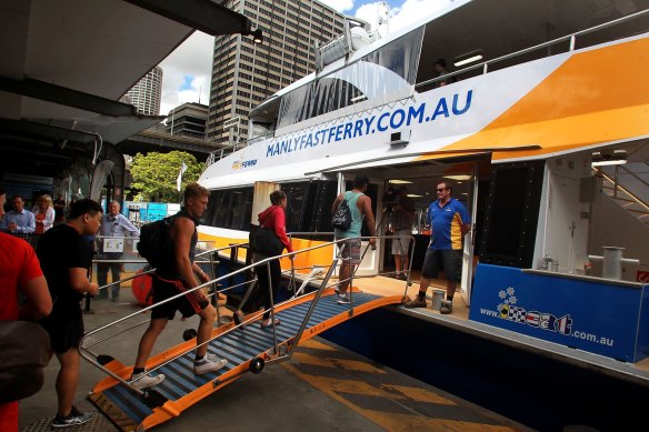 Customers board a Manly Fast Ferry in 2015. The NRMA-owned company is still operating but has stood down casual workers this week because of coronavirus-related shutdowns.