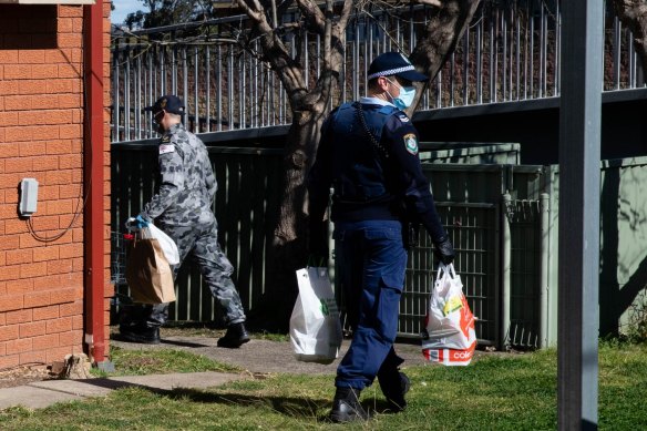 Police and the ADF jointly deliver groceries to people in isolation in the Fairfield LGA.