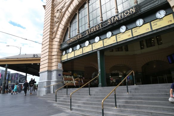 Meet you under the clocks: Flinders Street Station steps are empty.