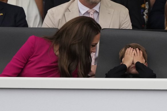 Kate, Duchess of Cambridge, left, and Prince Louis attend the Platinum Jubilee Pageant outside Buckingham Palace in London on Sunday.