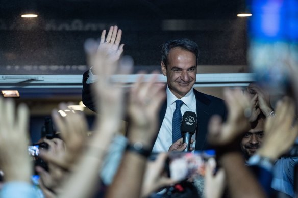 Greek PM Kyriakos Mitsotakis, leader of New Democracy party, speaks to supporters outside the party’s headquarters in Athens following the general election on Sunday.