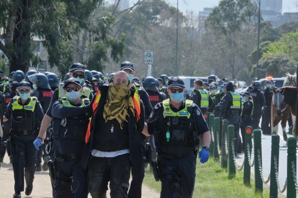 Police making arrests at Freedom Day Protest rally in Albert Park on September 5.