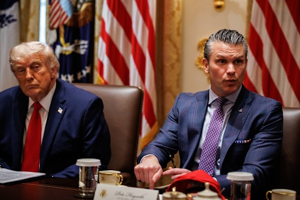 Donald Trump and Pete Hegseth in a cabinet meeting at the White House.