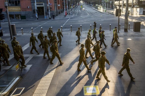 The Australian Defence Force patrols Melbourne’s CBD the day stage-four lockdown is announced. 
