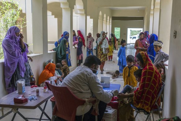 A member of medical staff takes a child’s blood sample for malaria screening during a medical camp set up by Medecins Sans Frontières at a rural health centre in the Dadu district of Sindh province, Pakistan.