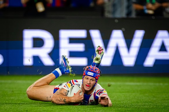 Kalyn Ponga scores for Newcastle.