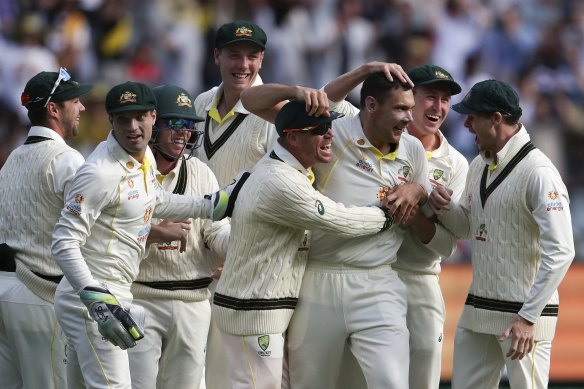 Australia celebrate with Scott Boland after the Victorian quick bowled Jack Leach.