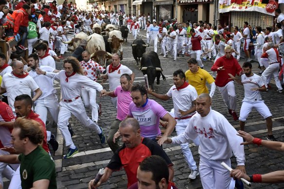 Running of the bulls in Pamplona, Spain in 2019. Good for tourism ... maybe less so for tourists.