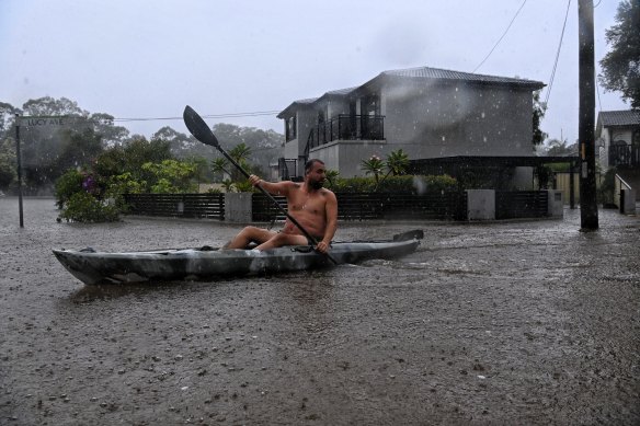 Homes and streets flood in Lansvale, in Sydney’s south-west, as the Georges River rises.