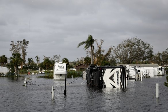 An overturned recreational vehicle (RV) in a trailer park following Hurricane Ian in Fort Myers, Florida, US