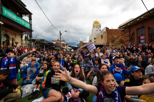 Western Bulldogs supporters fill the streets of Yarraville to watch the 2016 grand final.