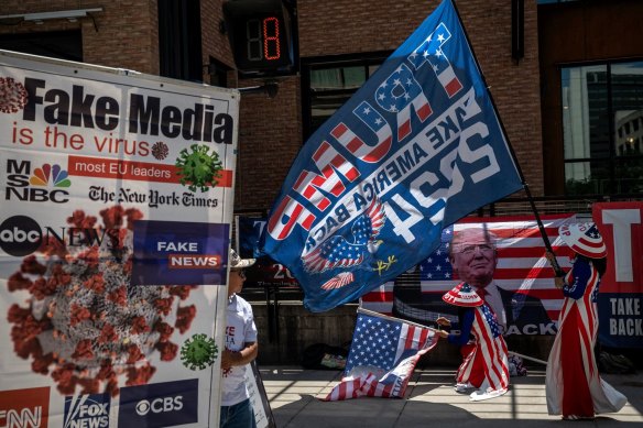 Supporters of Trump during the convention attacking the media.