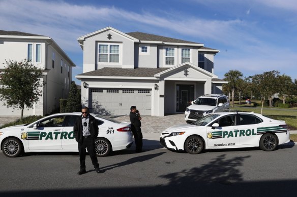 Police officers and security patrol outside a home, where former Brazilian president Jair Bolsonaro temporarily resides during his visit to the US, in Kissimmee, Florida.